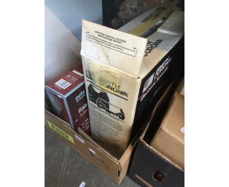 A box containing a Samsung DVD player, a Smith Corona electronic typewriter and a raised adjustable feeder 
