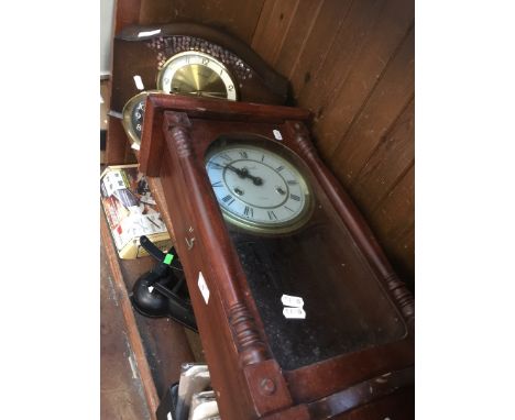 A wall clock, a mantle clock and an alarm clock 