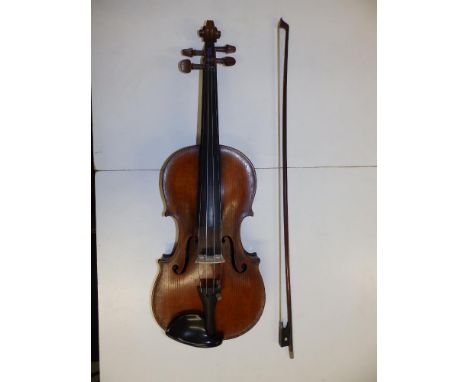 A Victorian violin with bow, the violin having 14" two-piece back, Stradivarius label inside.