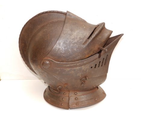 An antique close helm with roped comb, 13.5" across.