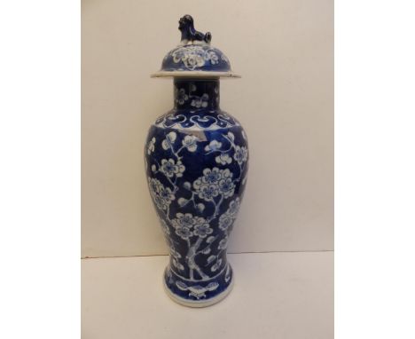 A 19thC Chinese blue &amp; white porcelain covered vase of slender meiping shape, painted with a prunus blossom pattern, a li