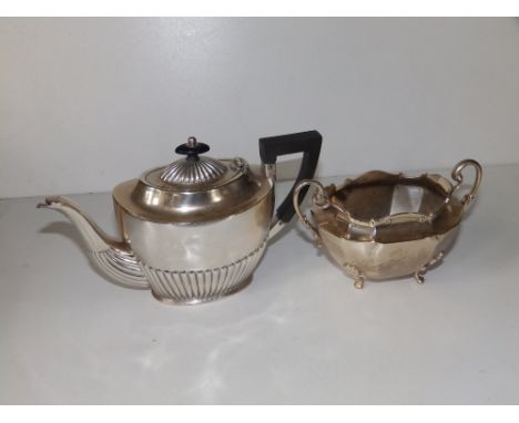 A small oval Birmingham silver half-reeded teapot,  8" across handle and a London silver two-handled sugar basin - both a/f. 