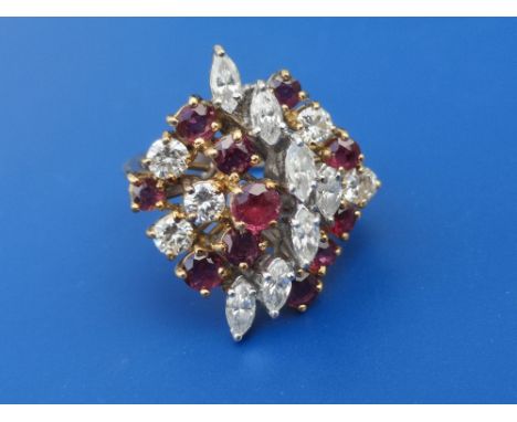 A 1950's/60's ruby &amp; diamond set cocktail ring, of open tiered asymmetric design, claw set with numerous brilliant, round