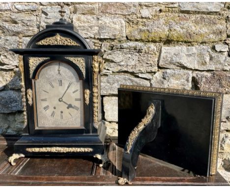 A 19thC ormolu mounted ebonised chiming bracket clock with bracket, the arched dial with strike/silent setting to arch betwee