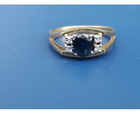 A modern sapphire &amp; diamond set 18ct gold ring.  Finger size M/N.