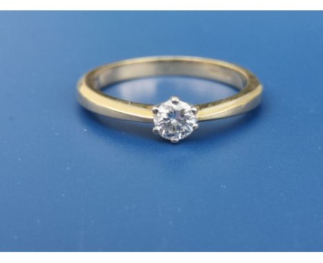 A modern diamond solitaire ring, the claw set brilliant weighing approximately 0.25 carat, on 18ct gold shank.  Finger size O