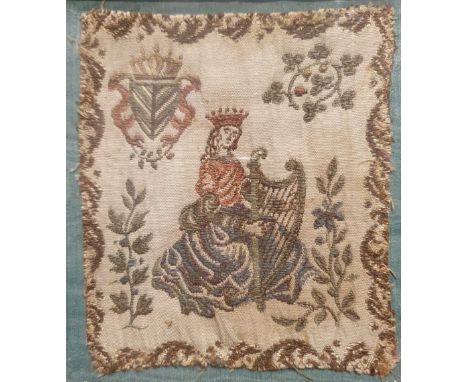 An antique Irish embroidery, depicting a crowned female figure playing a harp, a crowned harp and shamrock design above, 5.3"