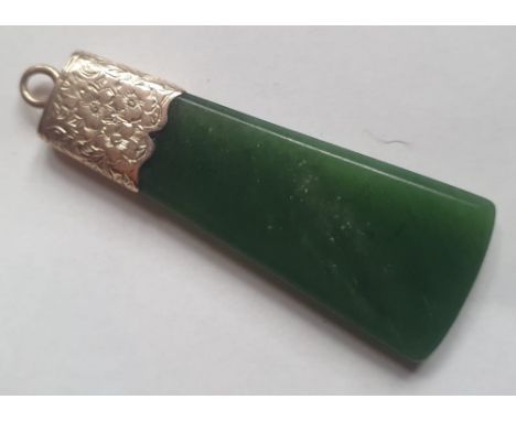 An antique New Zealand pounamu jade axe-head shape pendant with yellow metal mount, 1.9".