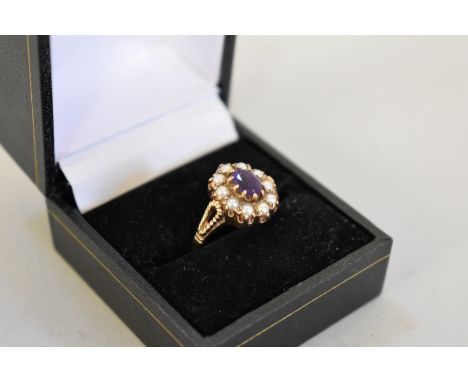 An amethyst and pearl gold ring, hallmarked 9ct, 3.7g total weight. 