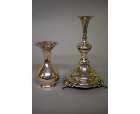 A Continental white metal candlestick, 23.5cm high; together with a similar baluster vase, 15cm high. (2) 