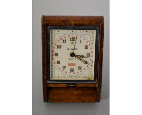 A vintage LeCoultre 8 day manual travelling timepiece, having brown leather cover, 83mm. 