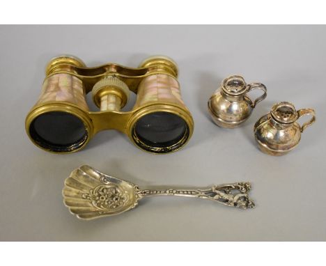 A silver novelty 'Guernsey jug' salt and pepper, by W.G &amp; S, Birmingham 1925, 4cm; together with a .800 spoon; and a pair