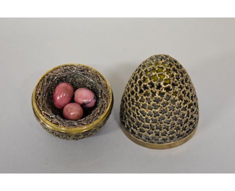 A silver&nbsp;surprise Easter egg,&nbsp;by&nbsp;Stuart Devlin,&nbsp;London 1972, containing pink onyx eggs in bird nest. 
