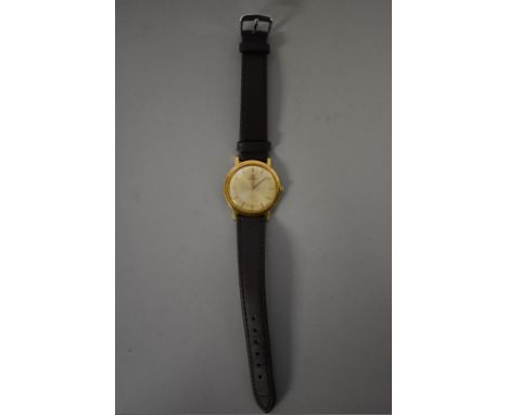 A circa 1962 Omega 18k gold manual wind wristwatch, 32mm, cal 620, on replacement leather strap. 