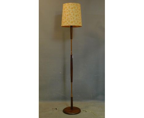 A 20th century teak and copper standard lamp, with shade, H.172cm 