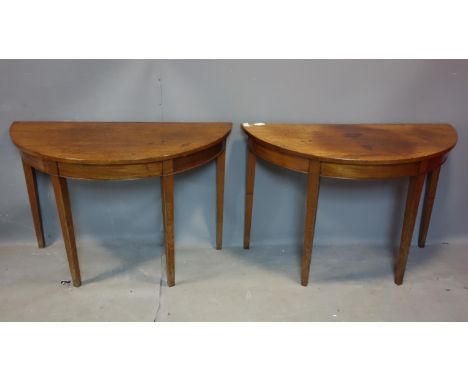 A pair of 19th century mahogany demi lume console tables, raised on tapered legs, H.72 W.110 D.52cm 