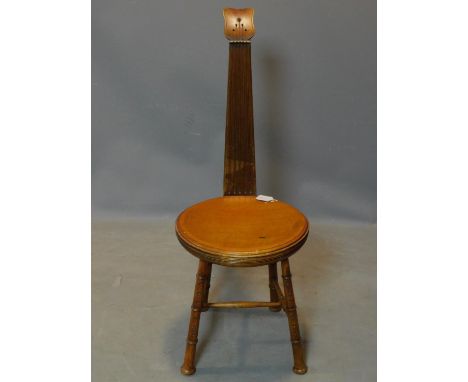 A mahogany musicians chair, the seat and backrest in the shape of a lute and the legs in the form of recorders, H.102cm 