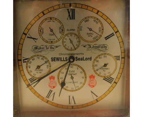 A Sewill's Sealord ships chronometer, having silvered dial with Roman numerals in mahogany and brass case, H.10 W.18.5 D.18.5