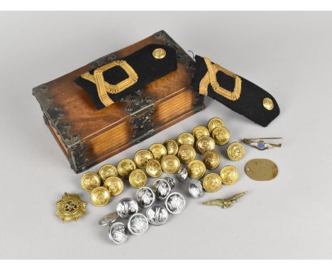 A Metal Mounted Oak Box Containing Military Badges, Buttons, Epaulettes Etc