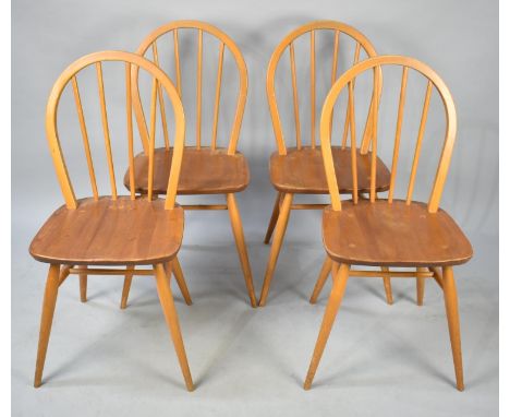 A Set of Four Ercol Spindle Back Dining Chairs