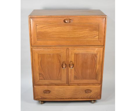 A Mid 20th Century Ercol Fall Front Bureau with Panelled Doors to Shelved Centre Section and Base Drawer, 81cms Wide, One Han