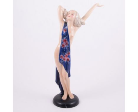 Josef Lorenzl for Goldscheider, an Art Deco figure of a lady, modelled standing nude with a drape over one shoulder, on black