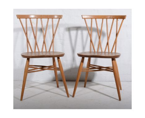 Ercol, a pair of 'Chiltern' dining chairs, elm and beech, cross spindle backs and cross stretcher design (2)