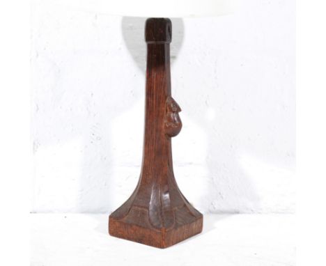 Robert "Mouseman" Thompson of Kilburn, an oak table lamp, tapering octagonal stem flared to square section base, carved with 