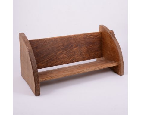 Robert 'Mouseman' Thompson of Kilburn, an oak book trough, carved signature mouse, width 45.5cm, depth 21cm, height 20.5cm.