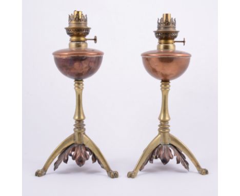 Pair of Victorian brass and copper oil lamps, in the manner of Benson, tripod bases, height 35.5cm (2).