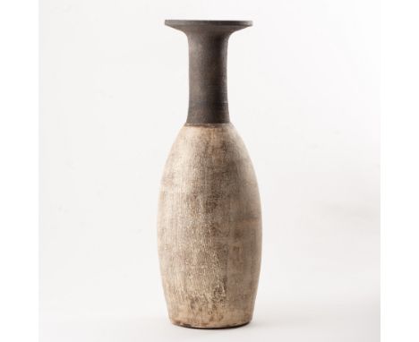 Hans Coper,a large bottle form with broad flared rim, circa 1955,combed design to slip glaze body, artist's seal mark to unde