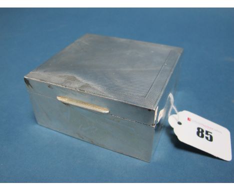 A Hallmarked Silver Cigarette Box, WHM, Birmingham 1933, of plain form with engine turned lid, 9.3cm wide.