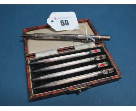 A Set of Four Bridge Pencils, each engine turned and highlighted in red and black enamel, stamped "Sterling Silver", 9.2cm lo