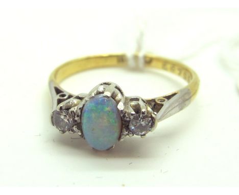 An Opal and Diamond Three Stone Ring, oval cabochon claw set to the centre, between two claw set diamonds, stamped "18ct PLA"