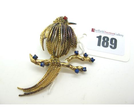 Christian Dior; A Vintage Costume Brooch, as a bird on a branch, of stylised design with claw set highlights, stamped "Chr.Di