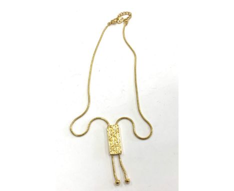 Vintage Christian Dior Gold Trotter Lariat Necklace 1980s, featuring lustrous gold plated metal, snake link chain and a fabul