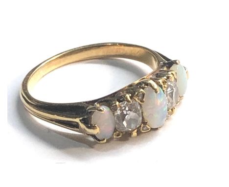 Vintage 18ct gold diamond and opal ring not hallmarked but tests as 18ct weight 3.1g&nbsp;opals look to be in good condition,