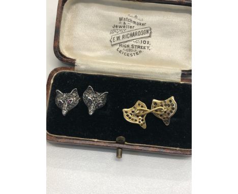 Pair of diamond fox head cufflinks, gold back, silver front, set with rose diamonds, with ruby eyes 
