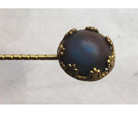 Antique saphiret stick pin stone measures approx 12mm dia set in a yellow metal stick pin measures approx 6cm long in good an