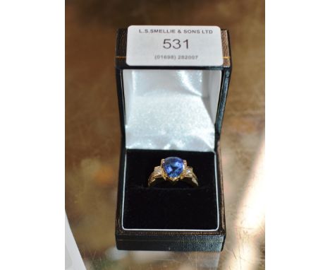 14 CARAT GOLD RING SET WITH A BLUE STONE, DIAMONDS &amp; DIAMOND CHIPS - APPROXIMATE WEIGHT = 6.5 GRAMS     