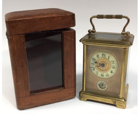 An early 20th century French lacquered brass carriage clock, 5.5cm rectangular dial with enamel chapter ring inscribed with A