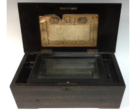 A 19th century Swiss combed rosewood cylinder musical box, plain rectangular hinged cover, bearing paper label listing six ai