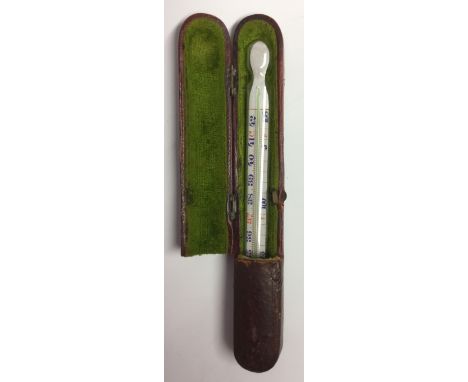 A 19th century mercury and glass thermometer, painted register, 12.6cm long, fitted red leather case en suite, 14.2cm long ov