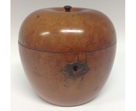 A late 19th century fruitwood novelty tea caddy, as an apple, hinged cover, brass escutcheon, 10cm high, c.1890