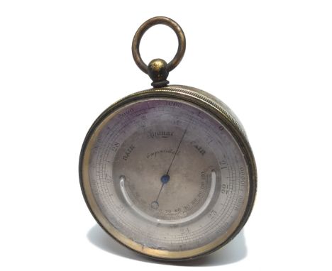 A Victorian circular brass pocket combination barometer and thermometer, 4.5cm silvered register engraved with various measur