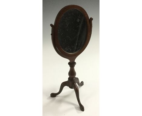 A 19th century mahogany tripod table mirror, oval tilting plate, cabriole legs, pad feet, 36.5cm high