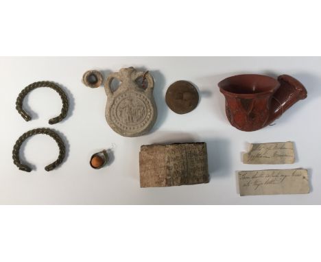 Antiquities - a two-handled earthenware lacrymatory or tear flask, possibly Graeco-Egyptian, moulded in low relief with deiti