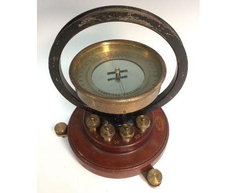 A mahogany and brass tangent galvanometer, by W G Pye & Co, Cambridge, 10.5cm silvered register, circular base, stamped No. 8