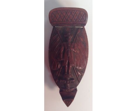 A 19th century coquilla nut novelty snuff box, as the hull off a ship, hinged cover carved in relief with a naval figure surm