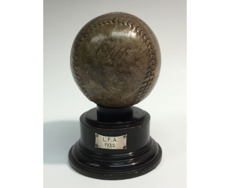 Sporting History - an early 20th century L.F.A. presentation cowhide baseball, indistinctly inscribed and dated, turned and e